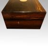 Antique coromandel writing slope side