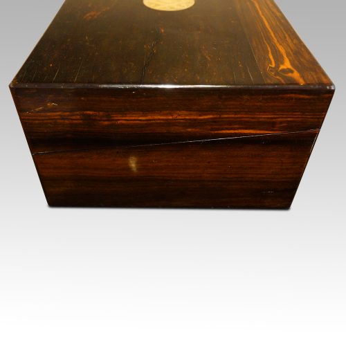 Antique coromandel writing slope side