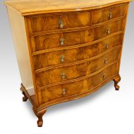 Maple & co walnut serpentine chest of drawers angle view