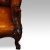 Victorian mahogany and leather reading chair arm