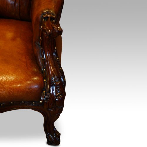 Victorian mahogany and leather reading chair arm