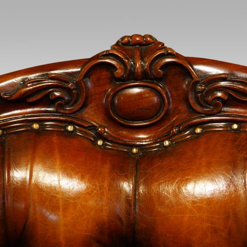 Victorian mahogany and leather reading chair back crest