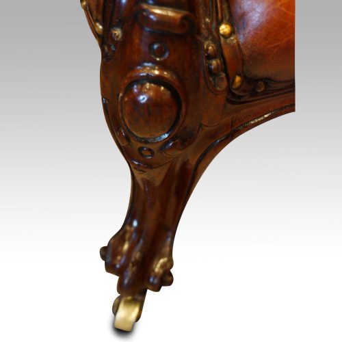 Victorian mahogany and leather reading chair front leg