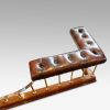 Edwardian oak and brass club fender button top