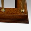 Edwardian oak and brass club fender corner detail
