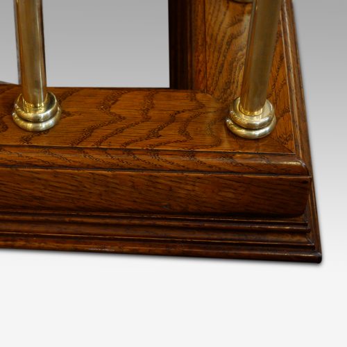 Edwardian oak and brass club fender corner detail
