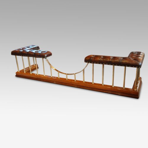 Edwardian oak and brass club fender front detail