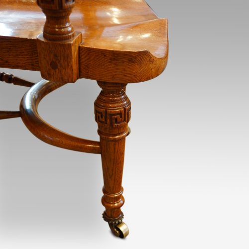 Edwardian oak desk chair by Bros. leg detail