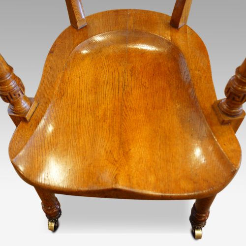 Edwardian oak desk chair by Bros. long seat