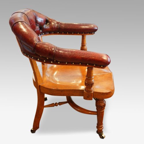 Edwardian oak desk chair by Bros. side view