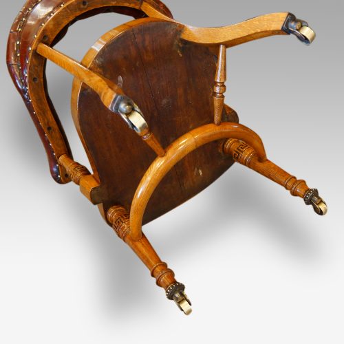 Edwardian oak desk chair by Bros. underneath