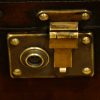 Leather trunk coffee table end lock plate