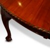 Maple & co mahogany extending dining table carved edge detail