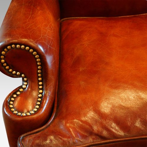 Queen Anne style high back leather wing chair arm
