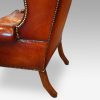 Queen Anne style high back leather wing chair back legs
