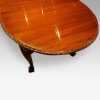 Waring and Gillow mahogany extending dining table bow end
