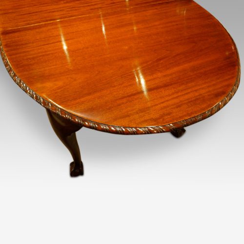 Waring and Gillow mahogany extending dining table bow end
