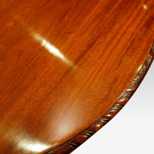 Waring and Gillow mahogany extending dining table carving