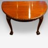 Waring and Gillow mahogany extending dining table end view