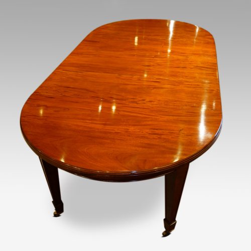 Edwardian circular mahogany dining table end view