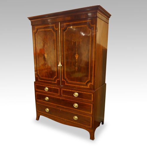 Georgian inlaid mahogany linen press at angle