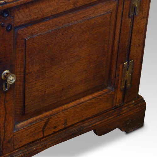 Antique oak dresser base door detail