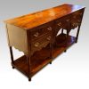 Antique oak potboard dresser base at angle