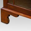 Edwardian mahogany glazed bookcase bracket foot detail