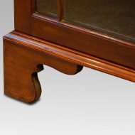Edwardian mahogany glazed bookcase bracket foot detail