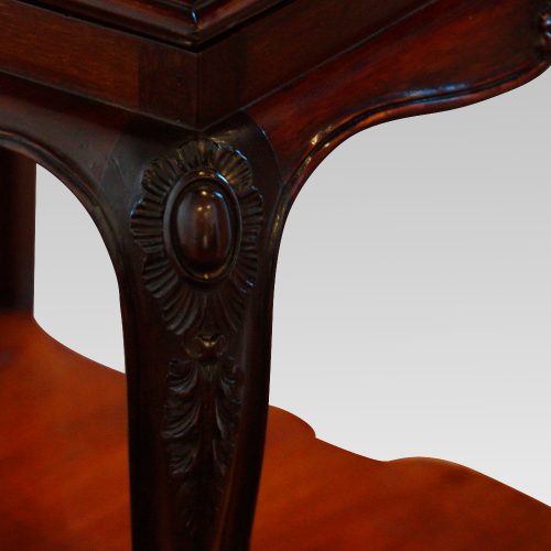 Edwardian mahogany revolving bookcase knee detail