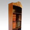 Mahogany open bookcase crest