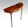 Pair Edwardian mahgany demi lune tables angle