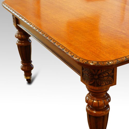 Victorian oak extending dining table carved edge