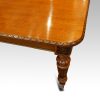Victorian oak extending dining table corner
