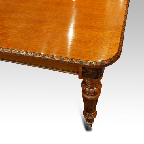 Victorian oak extending dining table corner