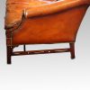 Edwardian mahogany camel back sofa end