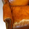 Georgian style leather wing chair arm detail