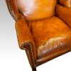 Georgian style leather wing chair arm roll