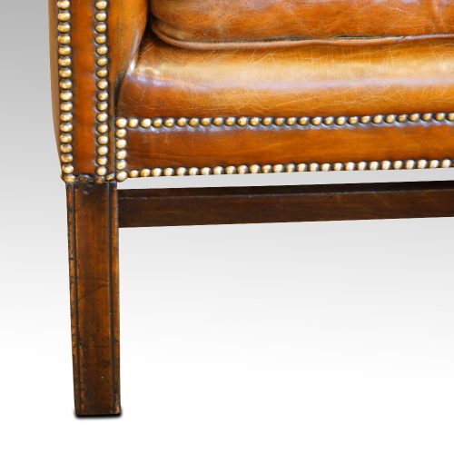 Georgian style leather wing chair leg
