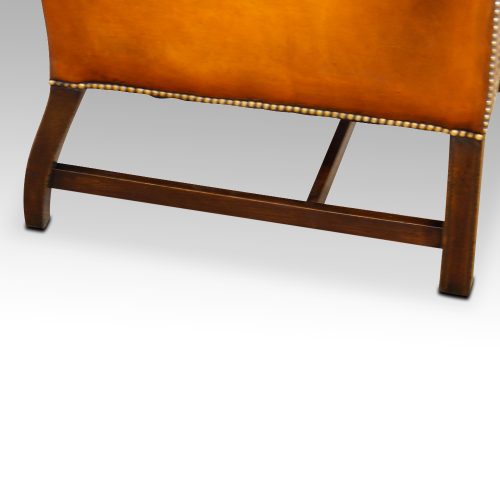 Georgian style leather wing chair stretcher