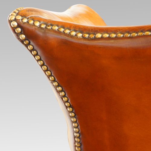 Georgian style leather wing chair studding