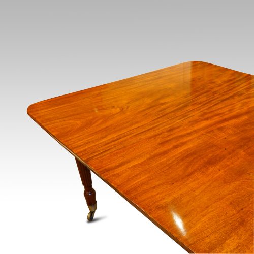 William IV mahogany extendng dining table corner