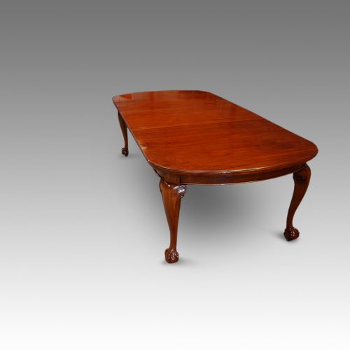Edwardian mahogany claw and ball extending dining table end view