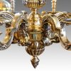 Pair of bronze chandeliers central finial