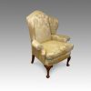 Queen Anne style wing-chair at angle