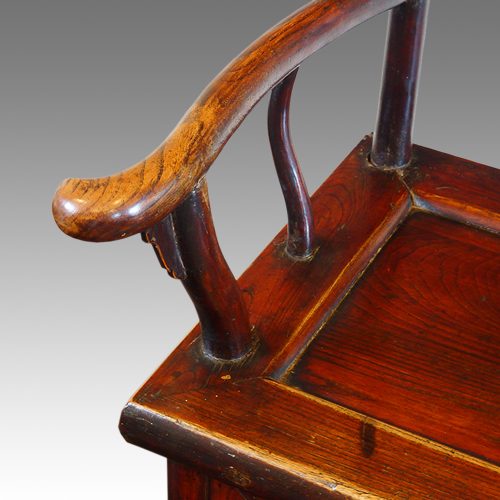 Pair of Chinese elm yoke chairs shaped arm