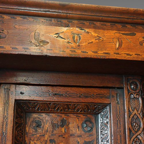 Antique oak court cupboard inlay cornice