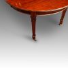 Edwardian extending mahogany dining table corner