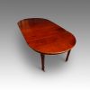 Edwardian extending mahogany dining table end view