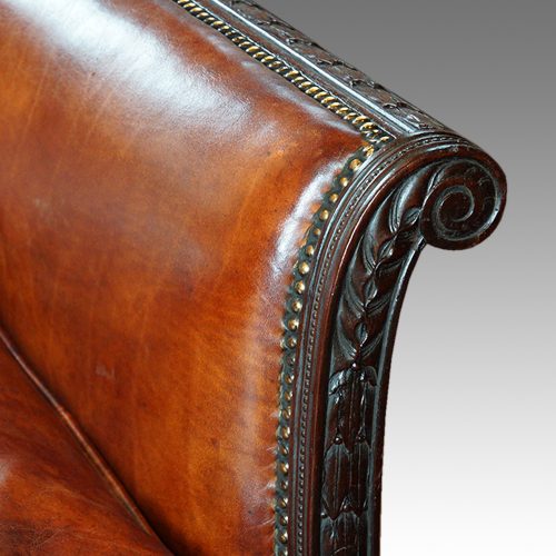 Edwardian mahogany leather sofa arm